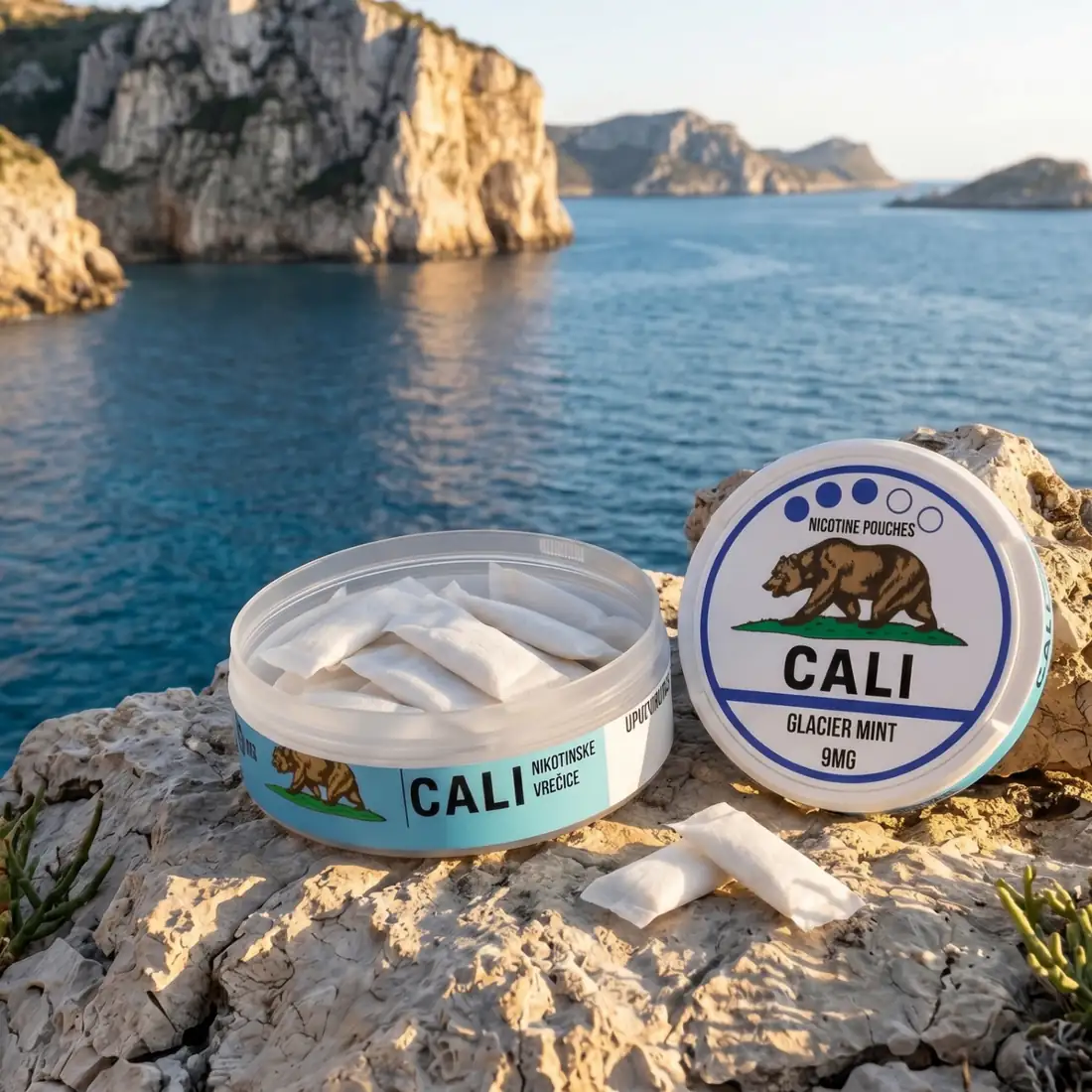 CALI Glacier Mint nicotine pouch can on Adriatic coast at golden hour